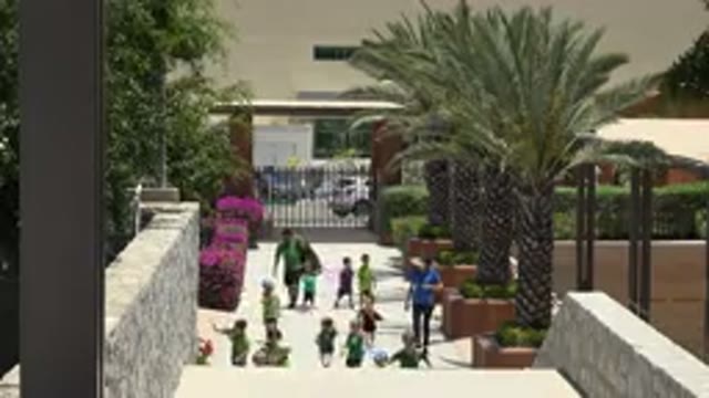 CABO SAN LUCAS MEXICO-2019: Kids Walking Through A Walkway With Plants And Trees