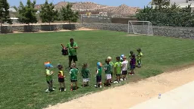 CABO SAN LUCAS MEXICO-2019: Coach And Child Athletic Team Doing Exercises In