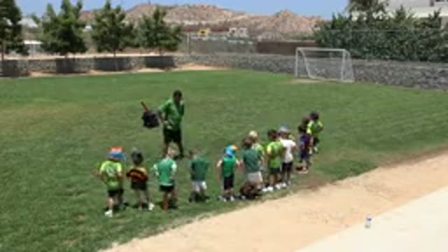 CABO SAN LUCAS MEXICO-2019: Man Wearing Green Shirt With Black Shirts Does Warm-Up Exercises