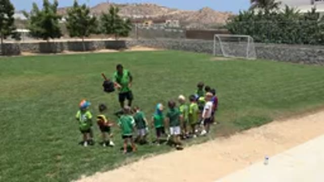 CABO SAN LUCAS MEXICO-2019: Little Confident Kids Playing Soccer On Grass