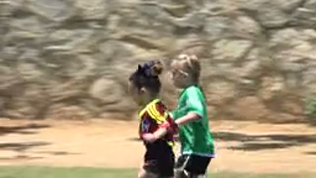 CABO SAN LUCAS MEXICO-2019: Two Little Cute Girls Running On A Soccer Field