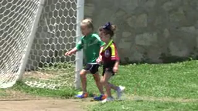 CABO SAN LUCAS MEXICO-2019: Kids Dressed In Sports Clothes Running On Lawn In