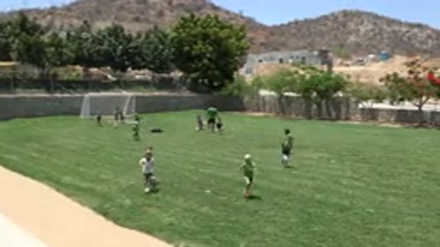 CABO SAN LUCAS MEXICO-2019: Little Kids Playing Soccer On A Clean And Green Field