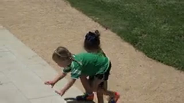 CABO SAN LUCAS MEXICO-2019: Two Little Girls In Sport Dress Green And Red Are Climbing Steps