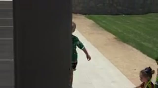 CABO SAN LUCAS MEXICO-2019: Little Children Play Soccer Game In Grass Green