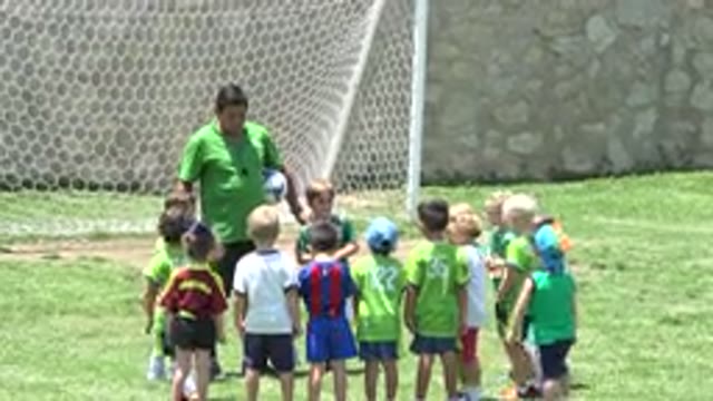 CABO SAN LUCAS MEXICO-2019: Kids Listening To Their Coach In Playground