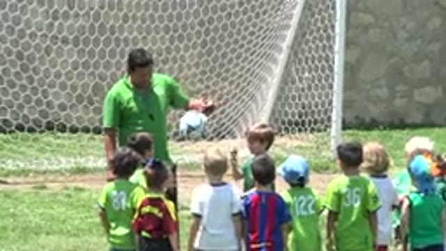 CABO SAN LUCAS MEXICO-2019: Soccer Coach Gives Instructions To The Little Children
