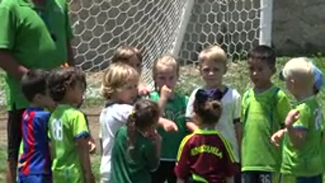 CABO SAN LUCAS MEXICO-2019: Group Of Kids Stand Near White Goal Net On A Sunny Day