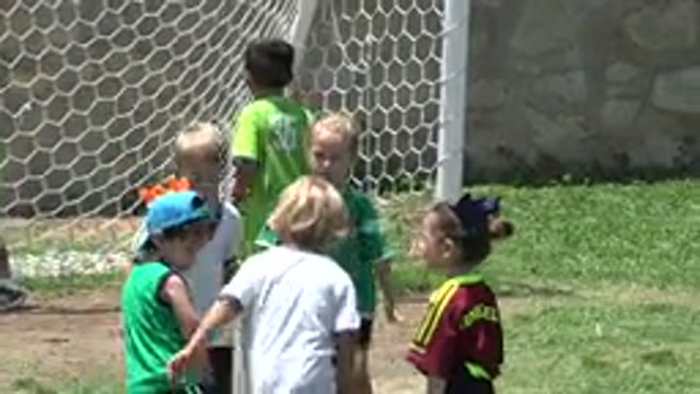 CABO SAN LUCAS MEXICO-2019: Young Children Playing Soccer Outside On Soccer Field
