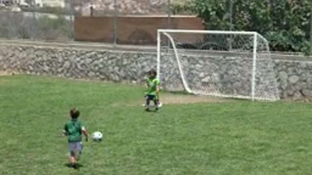 CABO SAN LUCAS MEXICO-2019: Children Soccer Goal Grass Game Teams Score Goalie