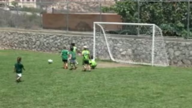 CABO SAN LUCAS MEXICO-2019: Little Boys Playing Soccer On A Vast Green Field