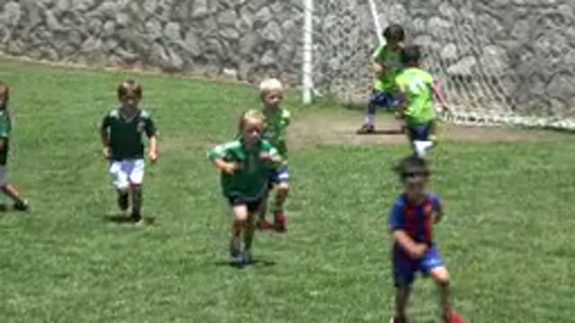 CABO SAN LUCAS MEXICO-2019: Little Kids Playing Soccer On A Grass Field