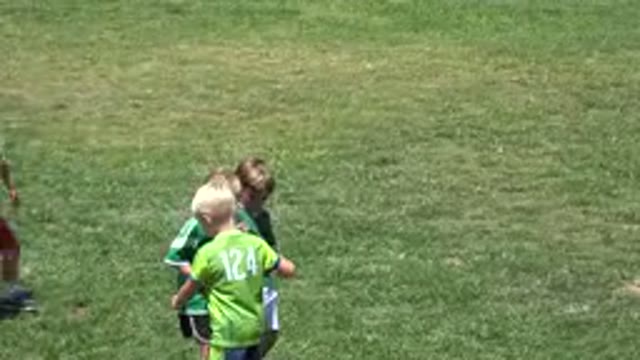 CABO SAN LUCAS MEXICO-2019: Boy Wearing Green Shirt With White Shorts Kicks Ball