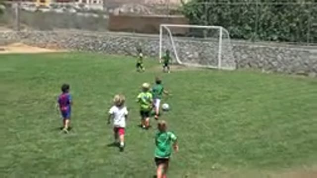 CABO SAN LUCAS MEXICO-2019: Little Kids Playing Soccer On Grass