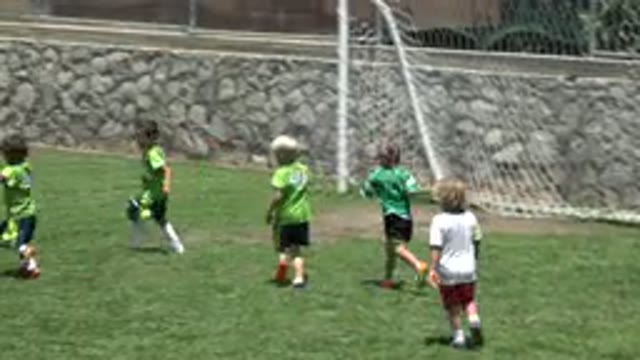 CABO SAN LUCAS MEXICO-2019: Children Playing Football Soccer On A Sunny Day