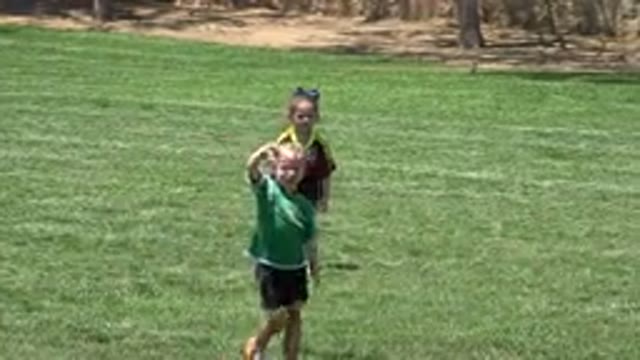 CABO SAN LUCAS MEXICO-2019: Girl Wearing Green Shirt And Black Shorts Walks On