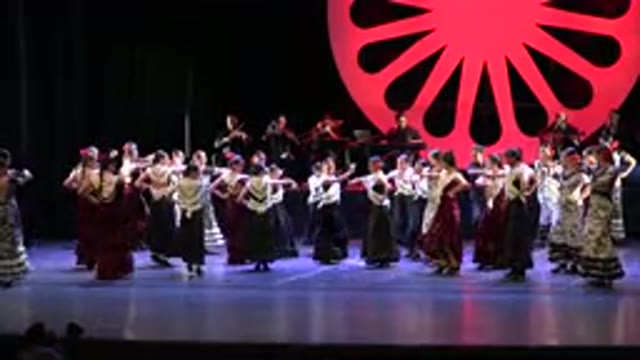 CABO SAN LUCAS MEXICO-2019: A Large Group Of Women Wearing Dresses Dancing And Performing