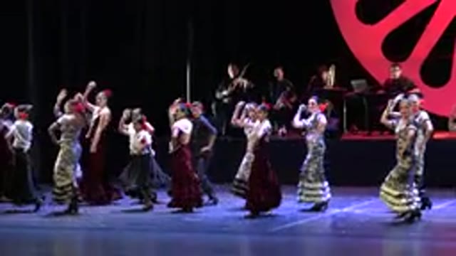 CABO SAN LUCAS MEXICO-2019: A Group Of Women In Full Length Dresses Dance On A Stage