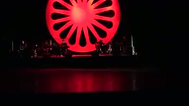 CABO SAN LUCAS MEXICO-2019: Band Concert In The Dark With A Red Giant Wheel In