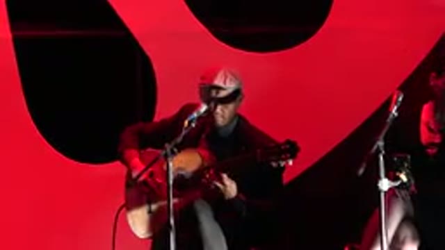 CABO SAN LUCAS MEXICO-2019: Man With Cap Performs Folk Music With Guitar