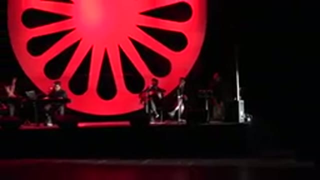 CABO SAN LUCAS MEXICO-2019: Band Singing On The Stage With A Hanging Red Circle