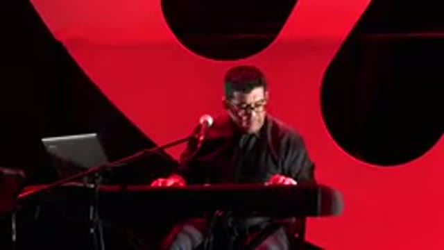 CABO SAN LUCAS MEXICO-2019: A Man On Stage Playing Keyboard And Singing