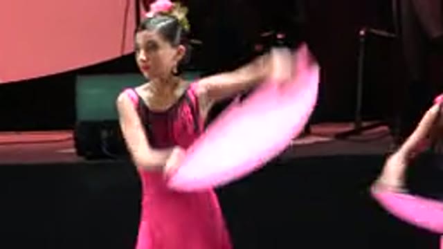 CABO SAN LUCAS MEXICO-2019: Group Of Women Dressed In Pink On A Stage Holding Fans