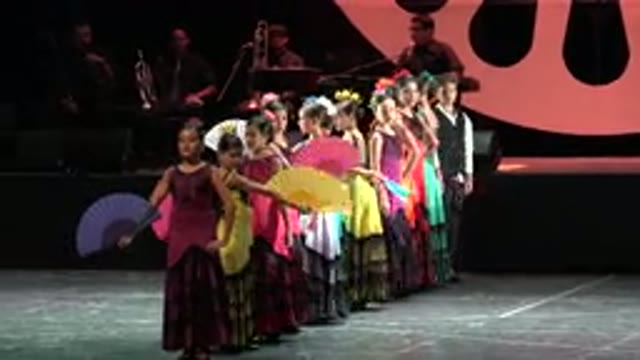 CABO SAN LUCAS MEXICO-2019: Young Girls In Colorful Dresses Dancing In A Line