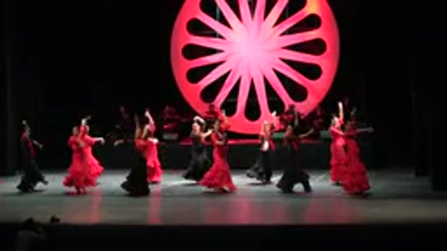 CABO SAN LUCAS MEXICO-2019: Several Women Wearing Long Black And Red Dress With Fringes Dancing On Stage