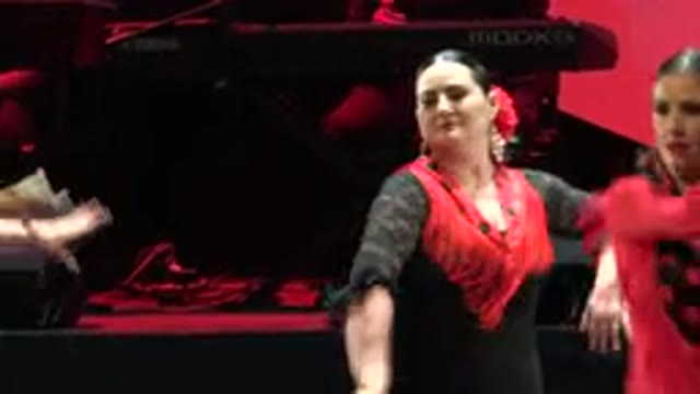 CABO SAN LUCAS MEXICO-2019: Woman in Red and Black Dress Dancing at Floral Event