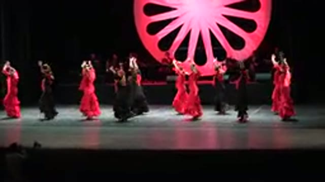 CABO SAN LUCAS MEXICO-2019: A Group Of Dancers In Scarlet Red And Black Dresses