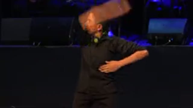 CABO SAN LUCAS MEXICO-2019: Man Wearing Black Shirt With Green Scarf Performs Dance