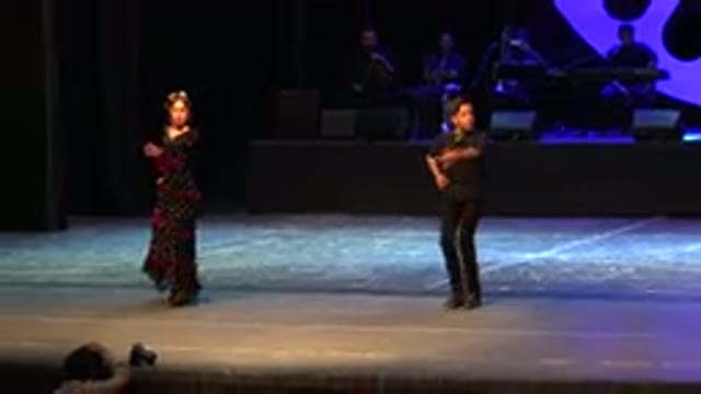 CABO SAN LUCAS MEXICO-2019: Two People Dancing To The Same Music On Stage For An