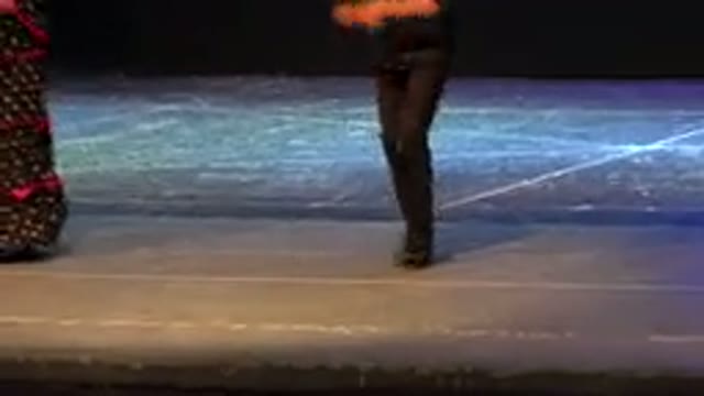 CABO SAN LUCAS MEXICO-2019: A Boy And Girl In Black Dresses Dancing On Stage