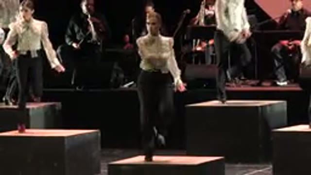 CABO SAN LUCAS MEXICO-2019: Tap Dancing Women On Stage Wearing White Blouse And Black Pants