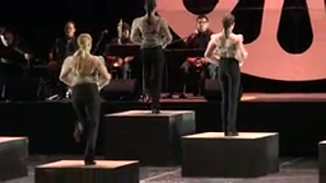 CABO SAN LUCAS MEXICO-2019: A Group Of Women On A Stage Dancing On Platforms