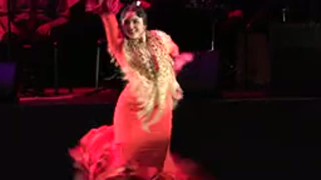 CABO SAN LUCAS MEXICO-2019: Woman in Red Dances Elegantly On Live Stage