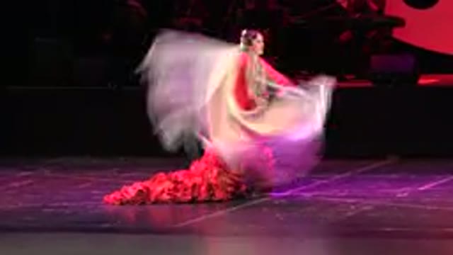 CABO SAN LUCAS MEXICO-2019: Woman In Red Long Dress With Ruffles Near The Stage