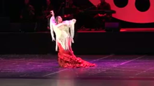 CABO SAN LUCAS MEXICO-2019: Adult Woman in White and Red Dress Performing Dance
