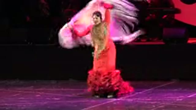 CABO SAN LUCAS MEXICO-2019: A Group Of Women Performing A Dance One Of Which Is Spinning With A Cape