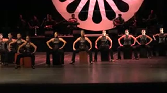 CABO SAN LUCAS MEXICO-2019: Group Of Numerous Women Dancing Sitting Down On Stage