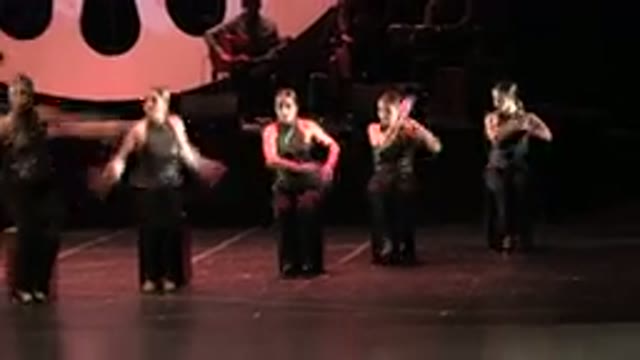 CABO SAN LUCAS MEXICO-2019: Dancers With Black Dresses And Ponytails Dancing On Stage