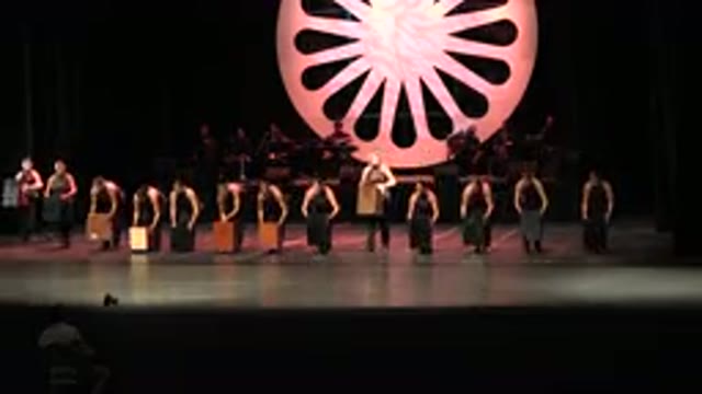 CABO SAN LUCAS MEXICO-2019: Row Of Women Set Wooden Boxes On Stage Then Sit On