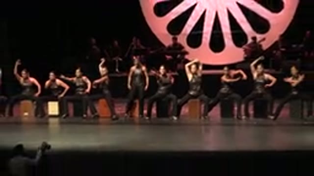 CABO SAN LUCAS MEXICO-2019: Performers Wearing Black Costumes Sitting In Line Indoors