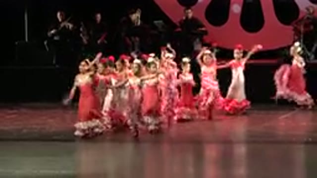 CABO SAN LUCAS MEXICO-2019: Many Children In Long Red Dresses In A Dance Performance