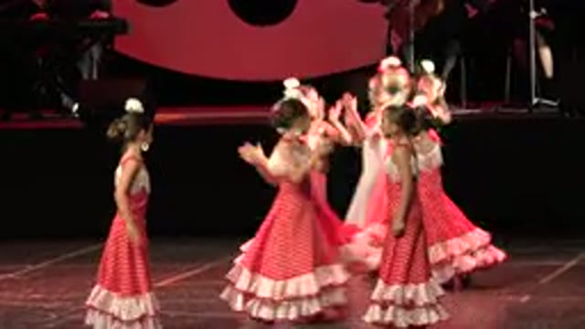 CABO SAN LUCAS MEXICO-2019: Young Girls In Red And White Dresses Clap And Dance