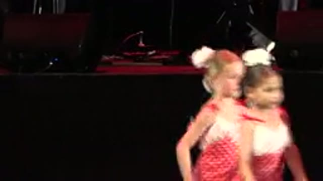 CABO SAN LUCAS MEXICO-2019: A Group Of Girls Wearing Full Length Dresses And Performing On Stage