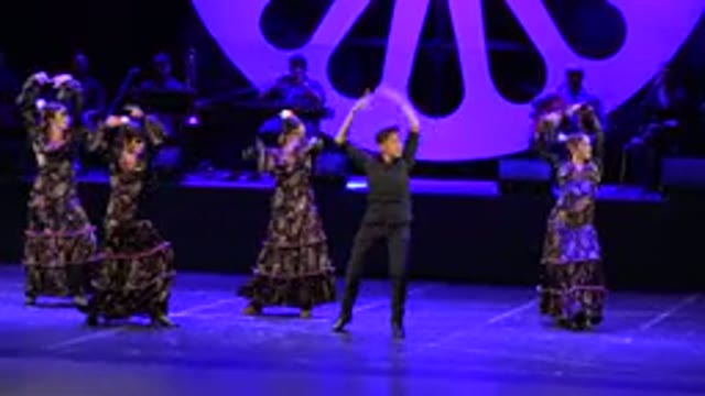 CABO SAN LUCAS MEXICO-2019: A Group Of Three Omens And One Man In Formal Attire On Stage