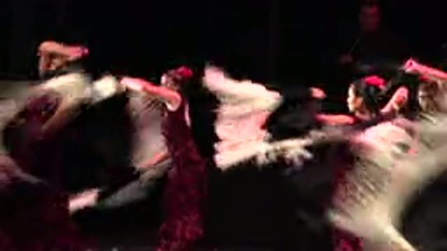 CABO SAN LUCAS MEXICO-2019: Women Dancing On Top Of A Dark Stage In Black And Red Dress