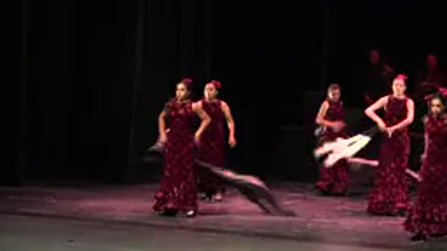 CABO SAN LUCAS MEXICO-2019: Women Wearing Red And Black Dresses Perform Dance On Stage